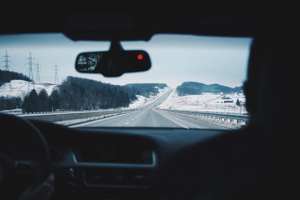 A car driving in a winter landscape