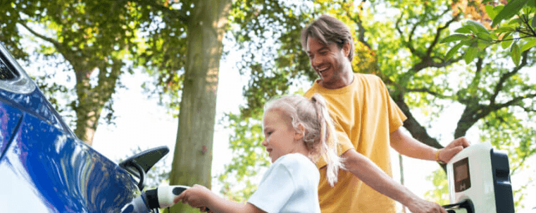 Father and child charging the car
