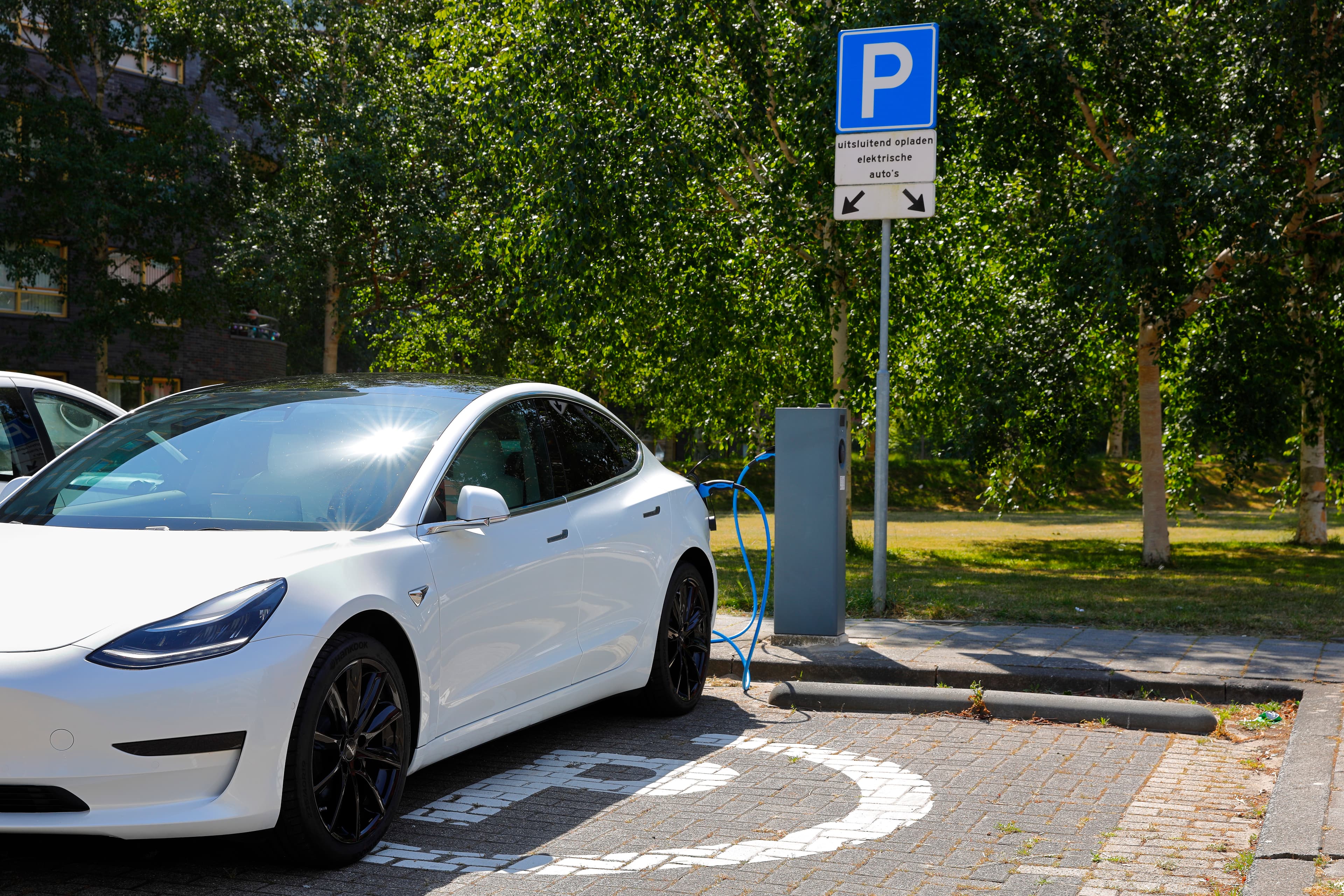 Parked Tesla getting charged
