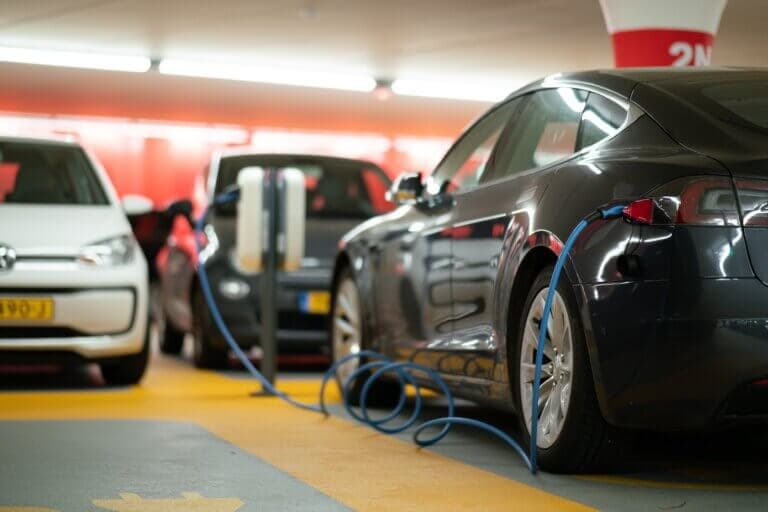 A vehicle charging in an underground parking garage